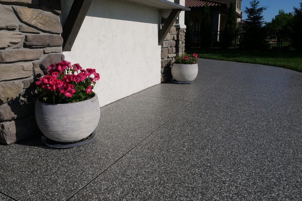 Seamless protective concrete coating with a glossy finish