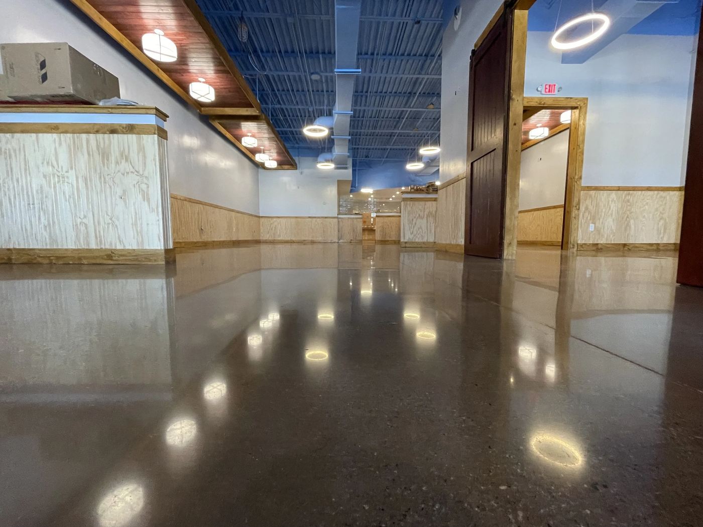 High-gloss polished concrete floor in a Denver space