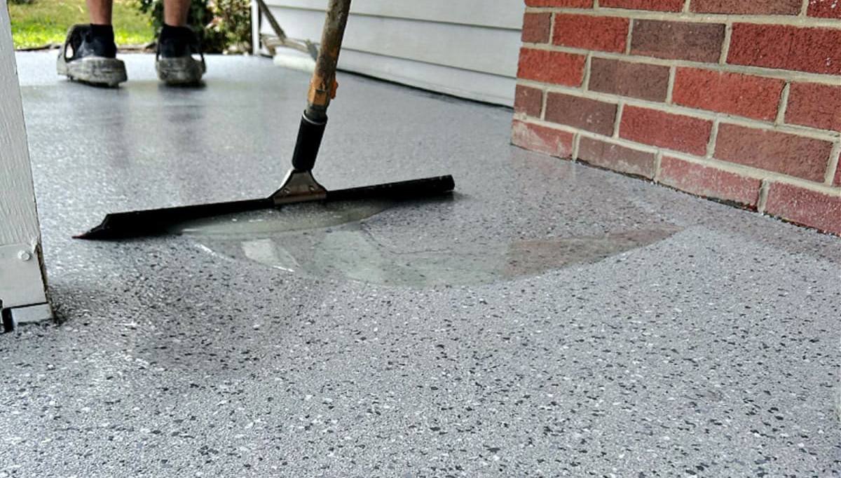 Applying a fresh epoxy coating to repair a failing floor in the Denver metro